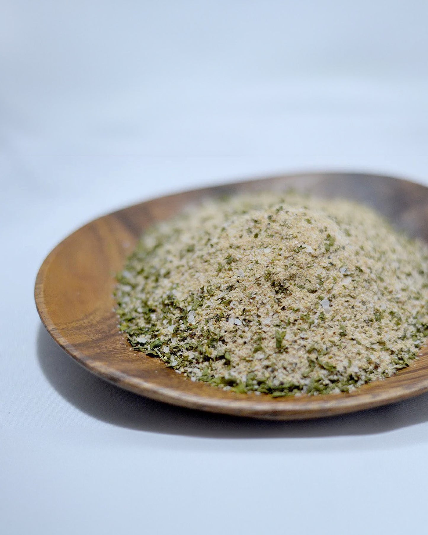 Close-up picture of Bonfire Butter seasoning on a wooden dish.