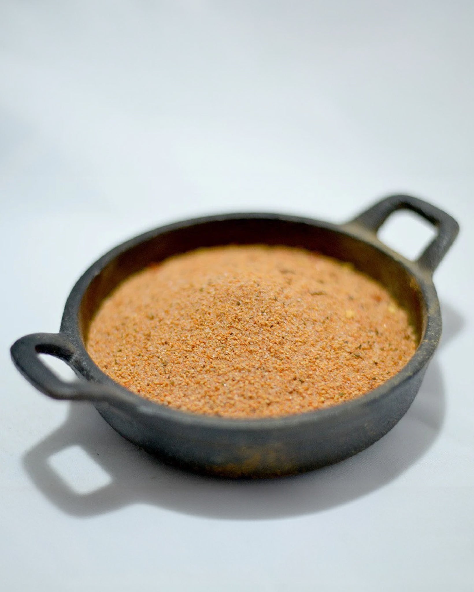 Close-up picture of Cayenne Candy seasoning in a mini cast-iron pan.