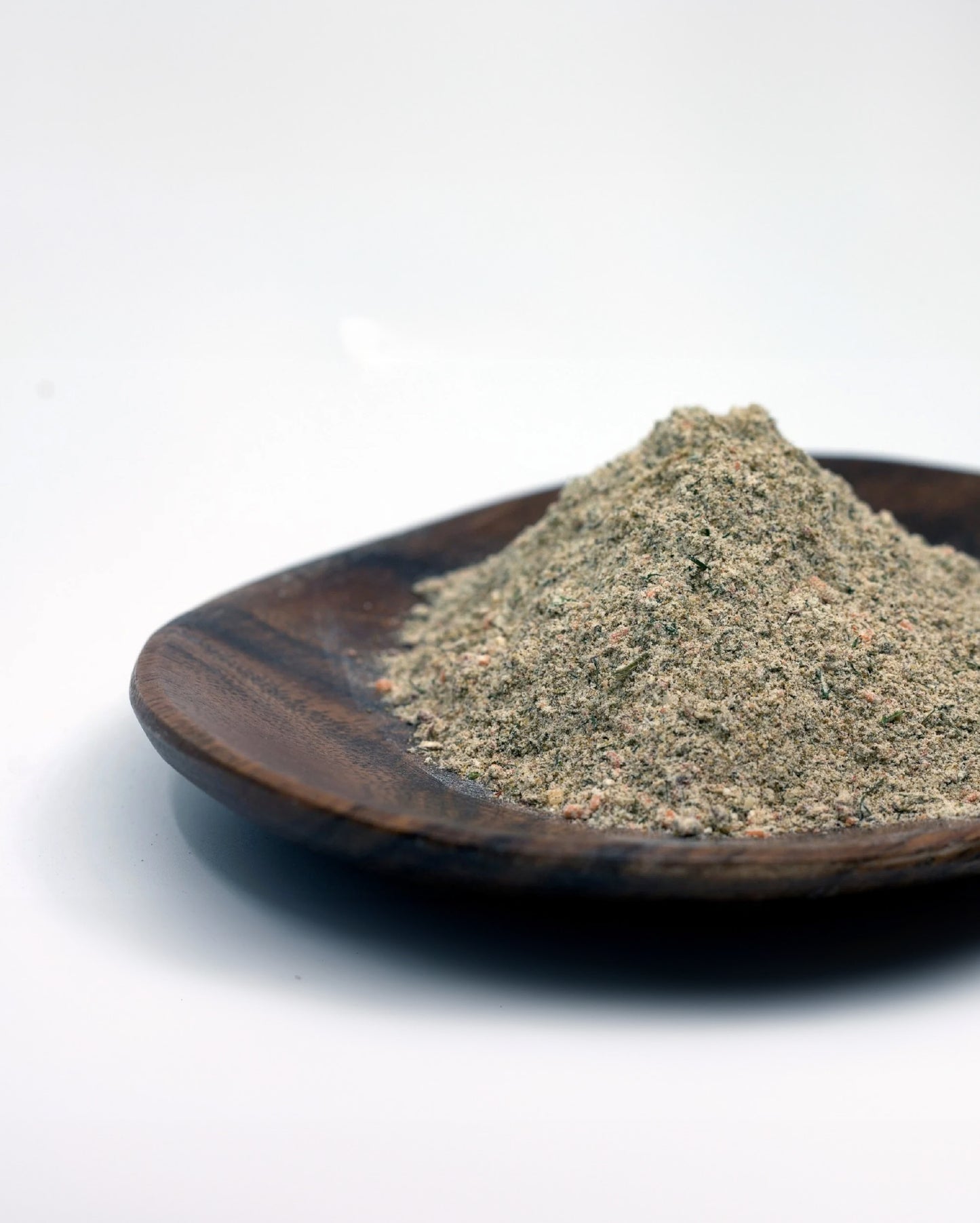 Close-up picture of Red Hot Ranch seasoning on a wooden dish.